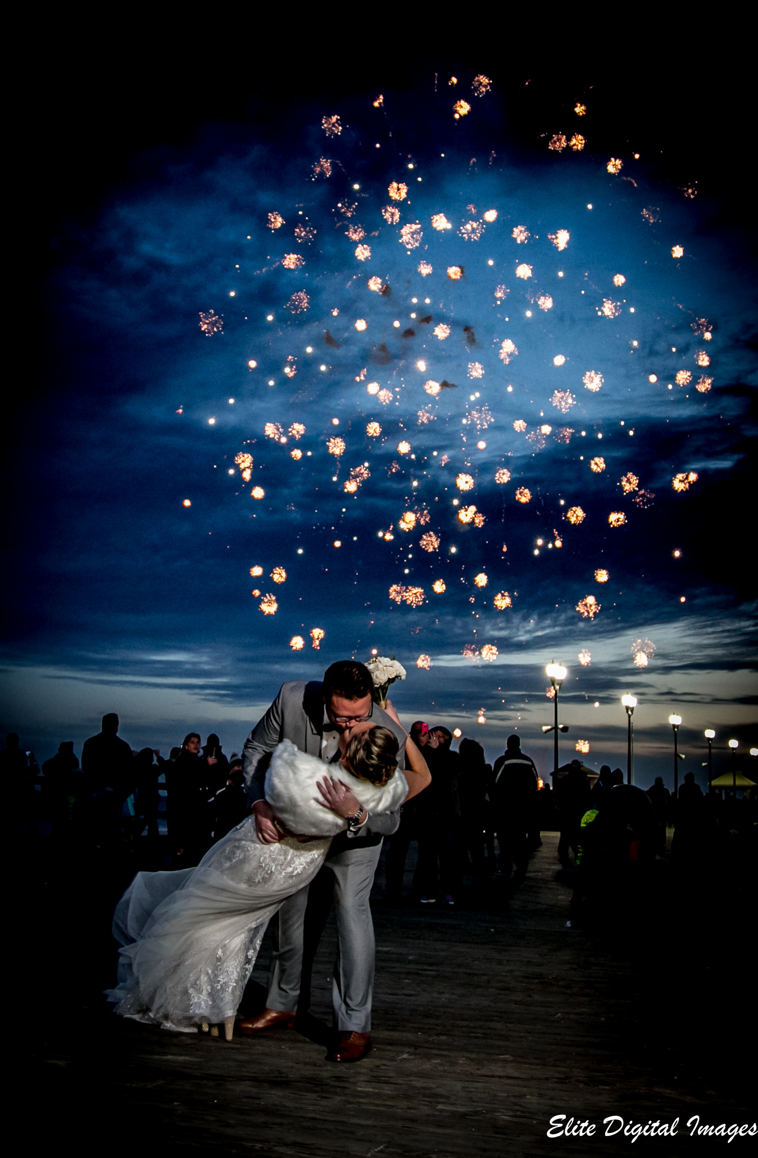 Fred and Lindsay kiss beneath the fireworks