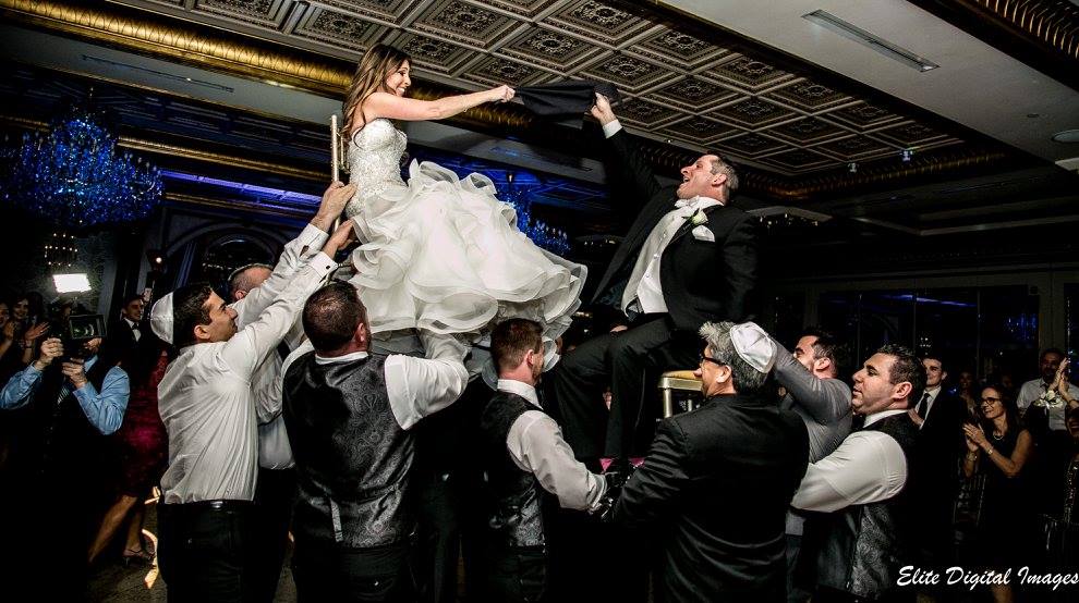 Michelle and Ed get lifted high during The Hora