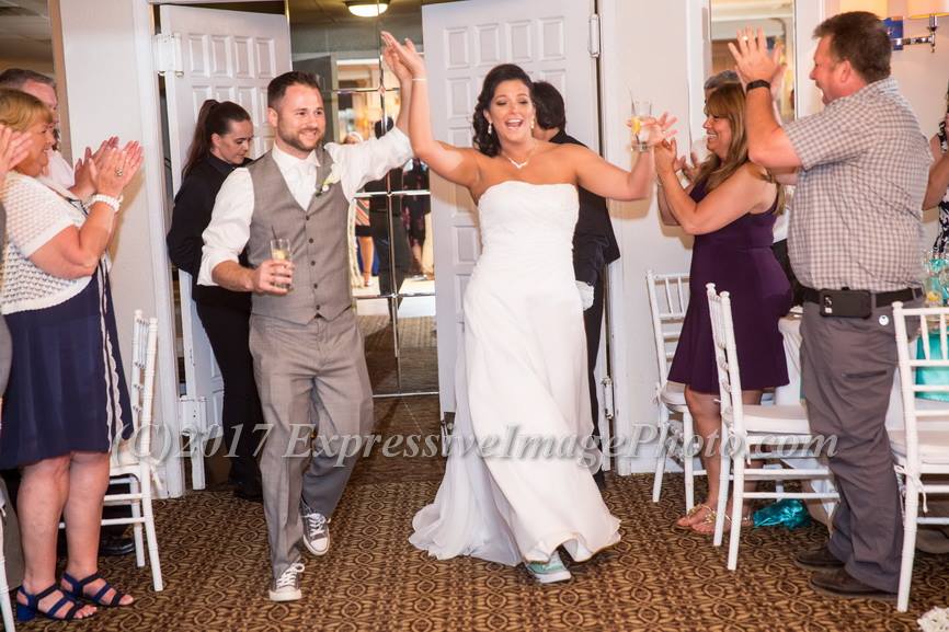 Love this shot Expressive Image for of Mike and Angeline's grand entrance. Do they look ready to party or what?