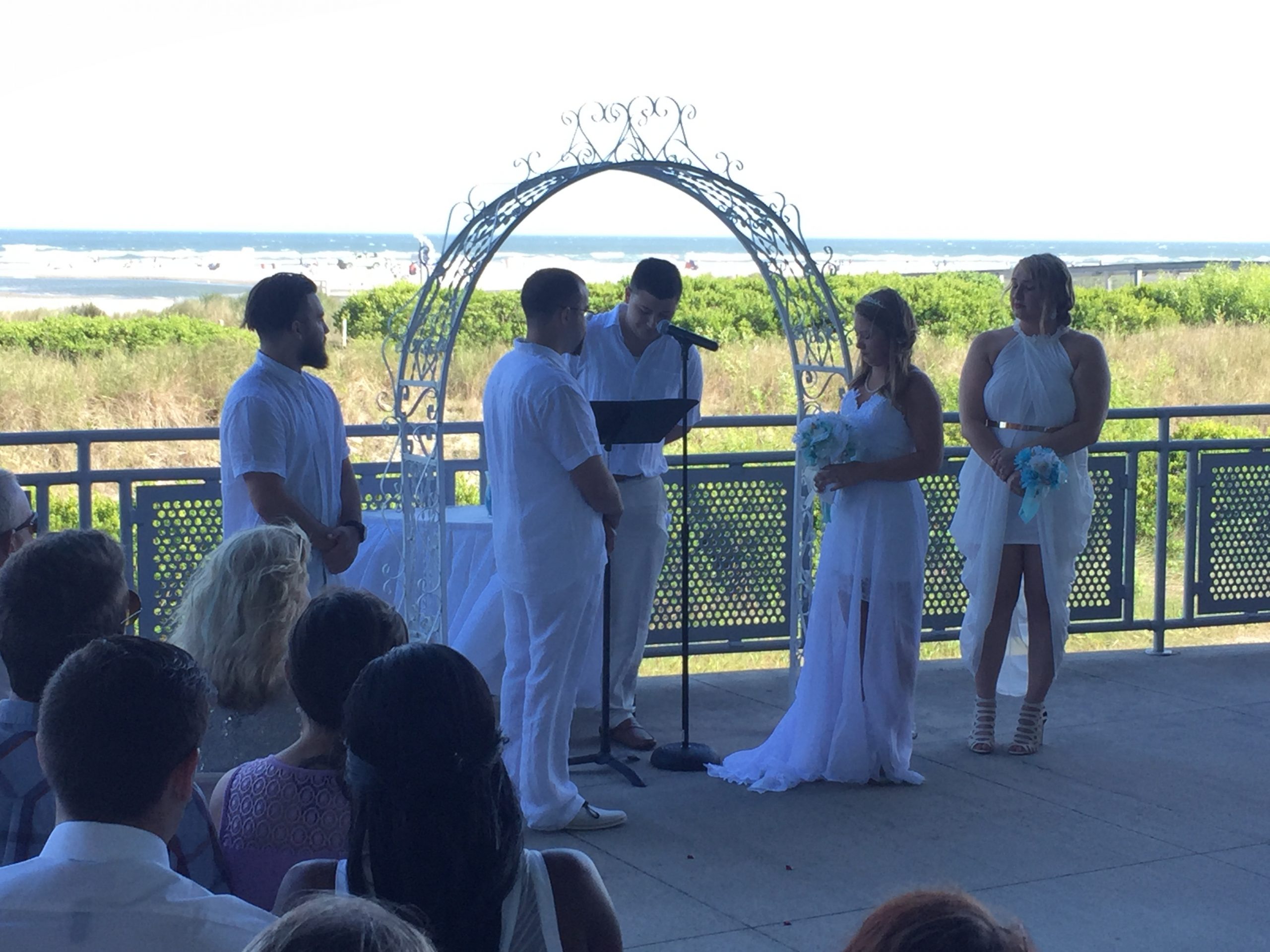 Corey and Jackson's ceremony with the beach in the background. Taken with my iPhone